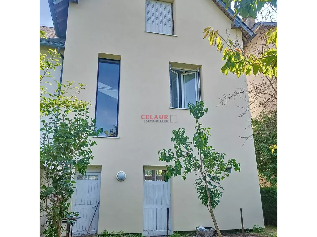 Maison mitoyenne avec jardin